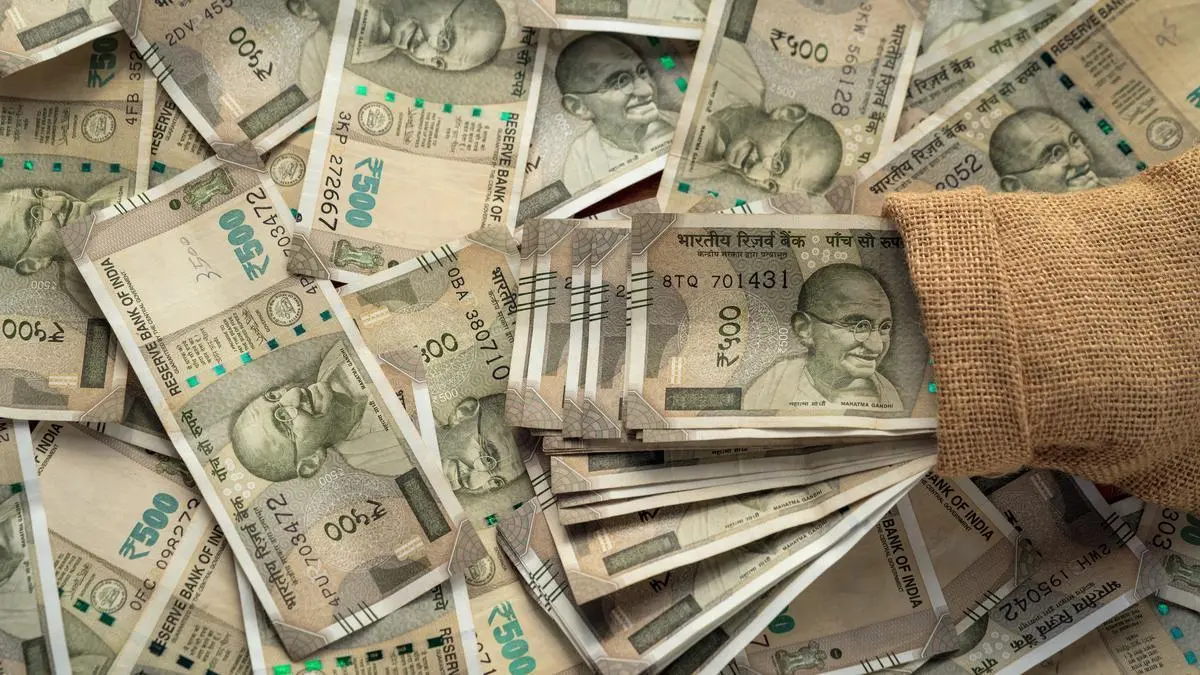 Rupee dragged by weaker Asian peers, held up by central bank line