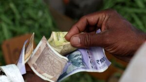 Rupee rises 12 paise to close at 90.26 against U.S. dollar