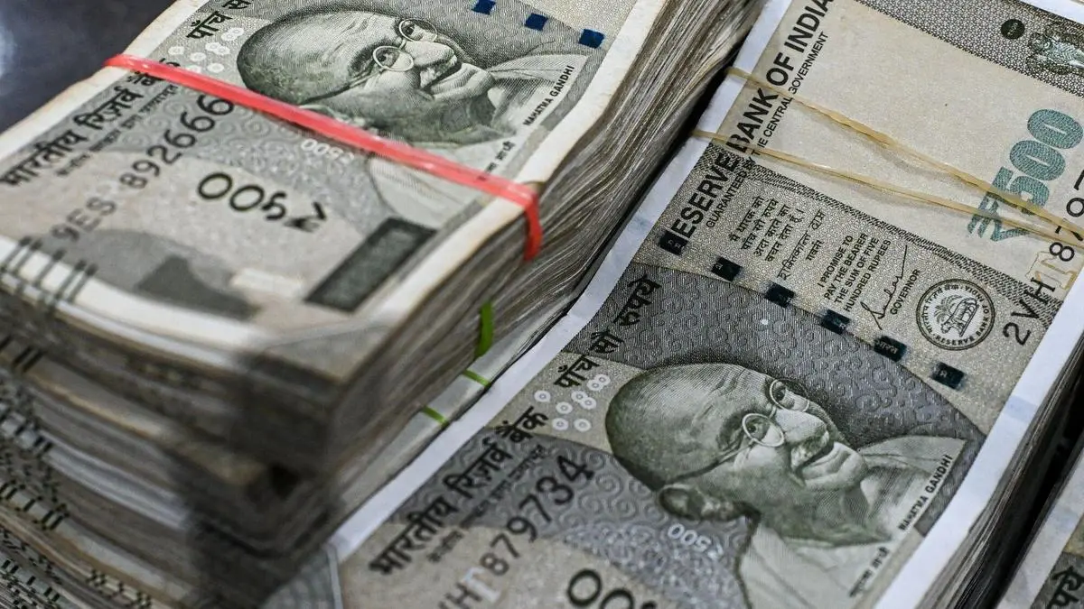 Rupee falls 23 paise to settle at fresh record low of 91.01 against US dollar