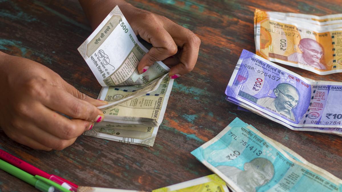 Rupee slips four paise to close at ninety point two one against the US dollar