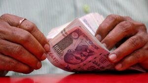 Rupee gains 12 paise to close at ninety point eighteen against US dollar